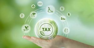 EnvironmentalTaxBreaksConceptHoldingGlassBallWithGreenTax - KSDT • Accountants & Advisors