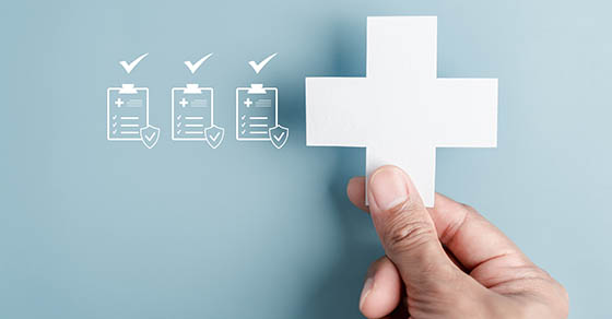 HealthcareInsuranceConceptWithMedicalCrossAndChecklistHealthCoverage